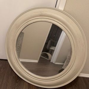 Round rustic white mirror.